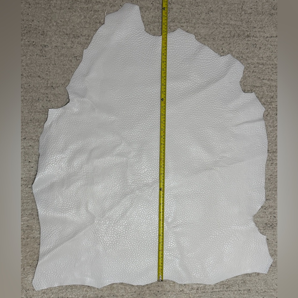 Tan Firm Embossed Leather Hide White color